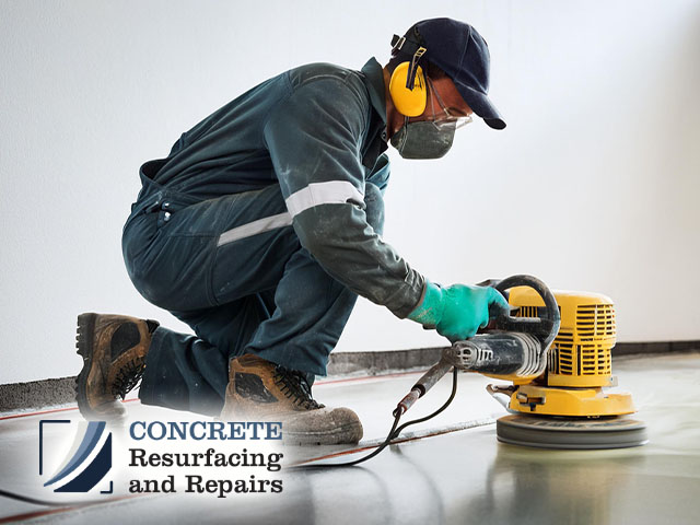 male technician professional working preparing concrete floor for polishing