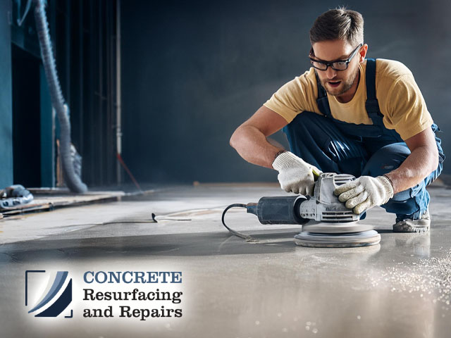 male technician professional working preparing concrete floor for expert polishing